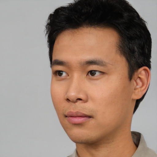 Neutral asian young-adult male with short  black hair and brown eyes