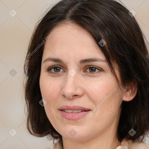 Joyful white young-adult female with medium  brown hair and brown eyes