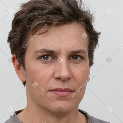 Joyful white adult male with short  brown hair and grey eyes