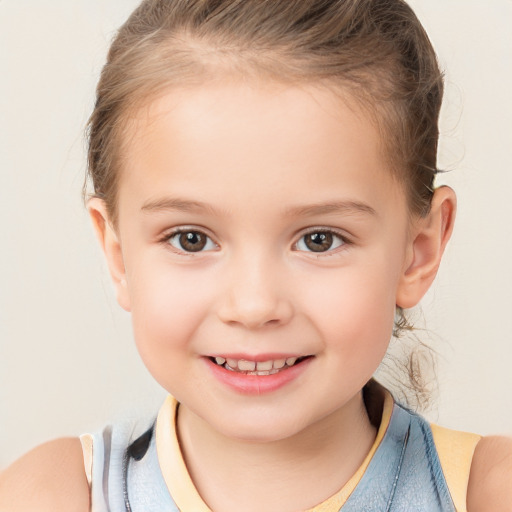 Joyful white child female with short  brown hair and brown eyes