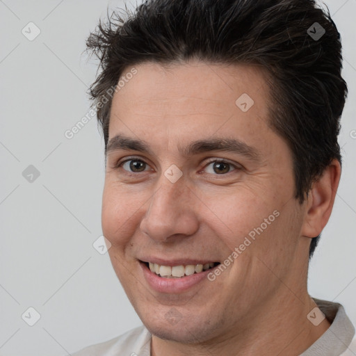 Joyful white adult male with short  brown hair and brown eyes