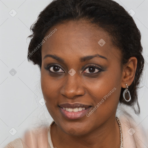 Joyful black young-adult female with long  brown hair and brown eyes