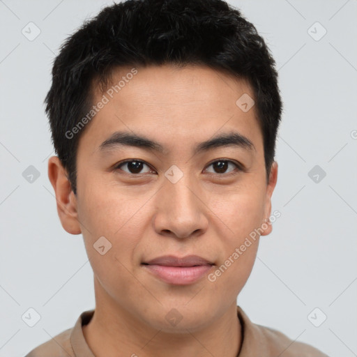 Joyful latino young-adult male with short  brown hair and brown eyes