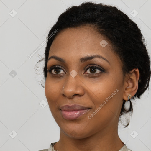 Joyful black young-adult female with medium  black hair and brown eyes