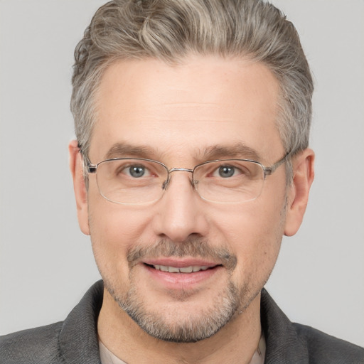 Joyful white middle-aged male with short  brown hair and brown eyes