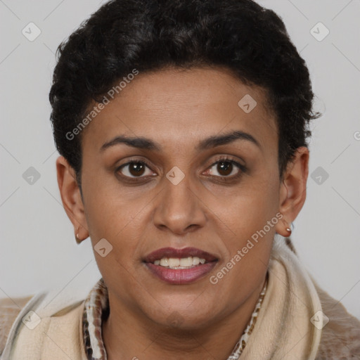 Joyful latino young-adult female with short  brown hair and brown eyes