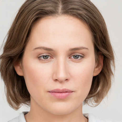 Neutral white young-adult female with medium  brown hair and blue eyes