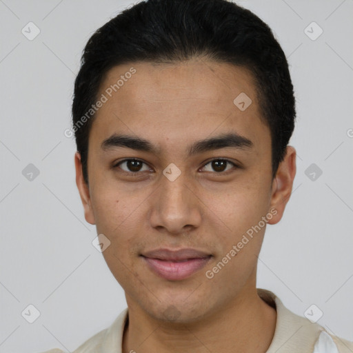 Joyful latino young-adult male with short  black hair and brown eyes