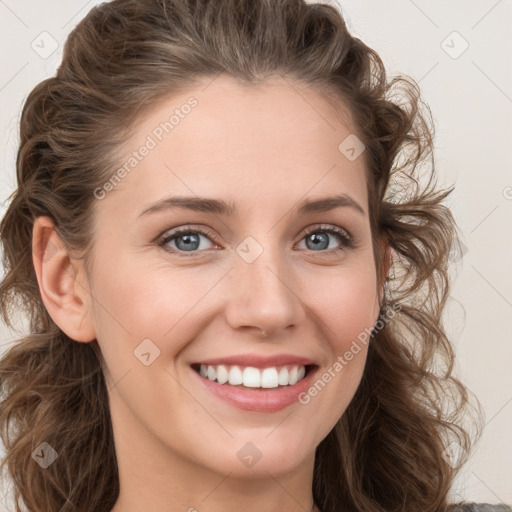 Joyful white young-adult female with medium  brown hair and blue eyes