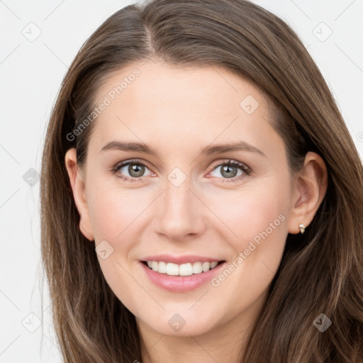 Joyful white young-adult female with long  brown hair and grey eyes