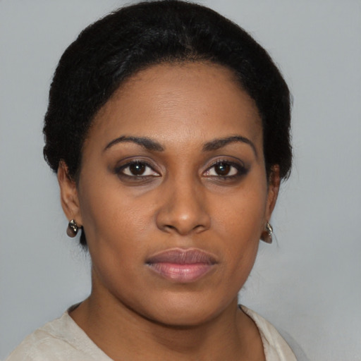 Neutral black young-adult female with short  black hair and brown eyes