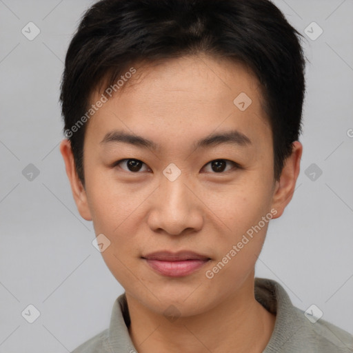 Joyful asian young-adult male with short  brown hair and brown eyes