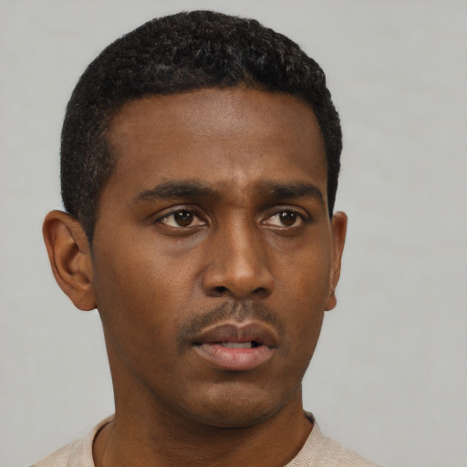 Neutral black young-adult male with short  black hair and brown eyes