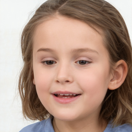 Joyful white child female with medium  brown hair and grey eyes