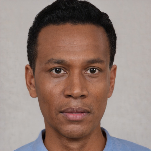 Neutral black young-adult male with short  black hair and brown eyes