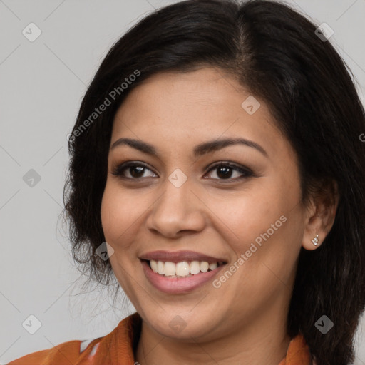 Joyful latino young-adult female with long  brown hair and brown eyes