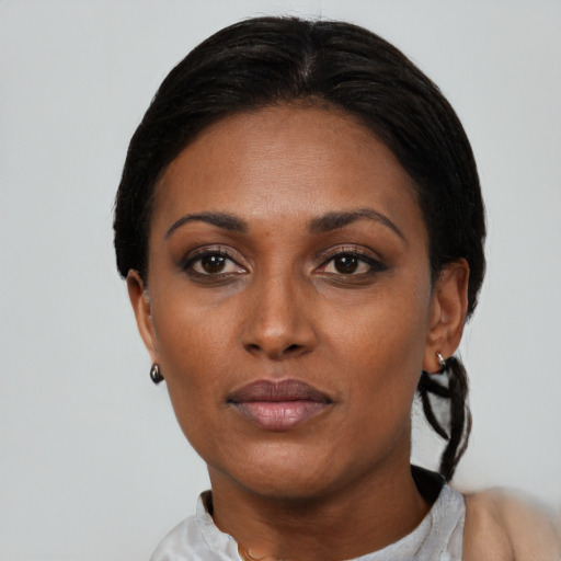 Neutral latino adult female with short  black hair and brown eyes