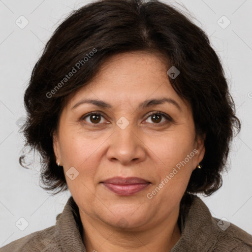 Joyful white adult female with medium  brown hair and brown eyes