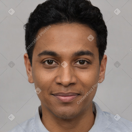 Joyful black young-adult male with short  black hair and brown eyes