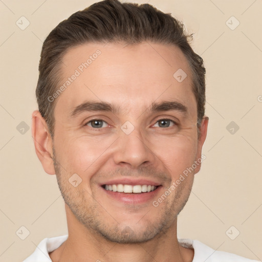 Joyful white adult male with short  brown hair and brown eyes