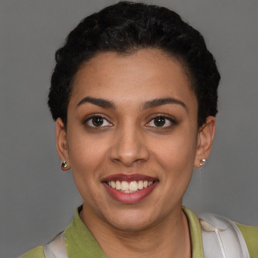 Joyful latino young-adult female with short  brown hair and brown eyes