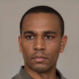 Neutral latino adult male with short  black hair and brown eyes