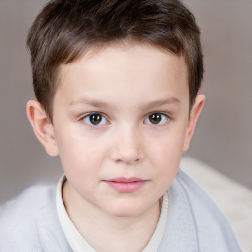 Joyful white child male with short  brown hair and brown eyes