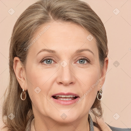 Joyful white adult female with medium  brown hair and grey eyes