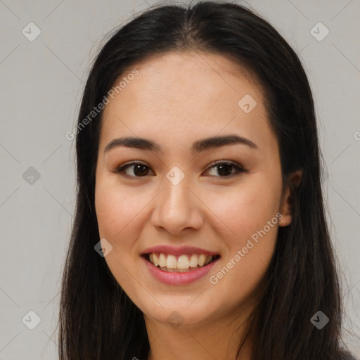 Joyful latino young-adult female with long  brown hair and brown eyes