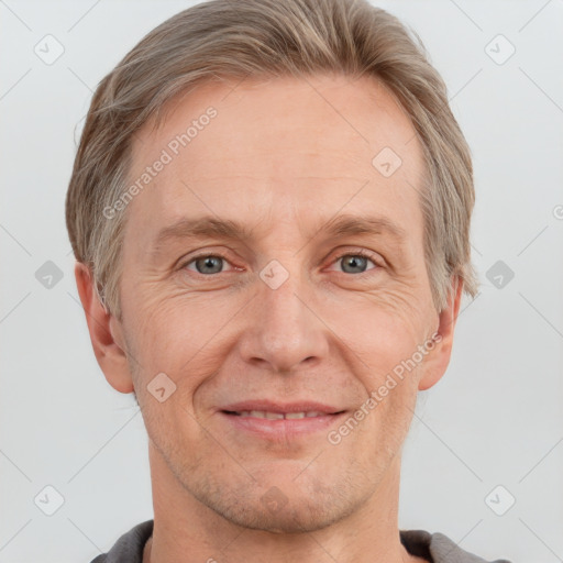 Joyful white adult male with short  brown hair and grey eyes