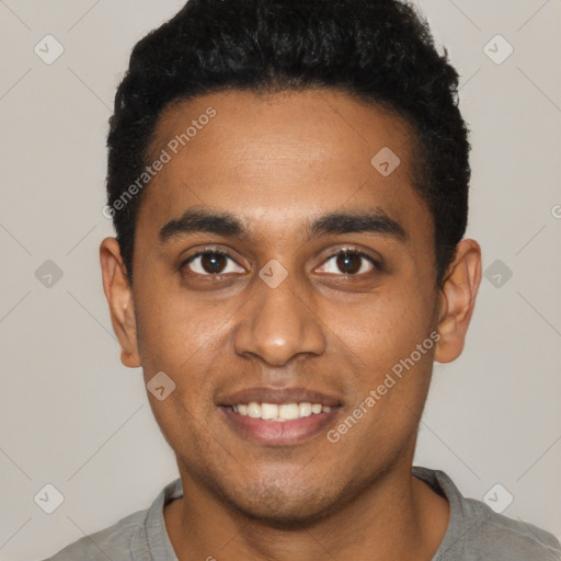 Joyful black young-adult male with short  black hair and brown eyes