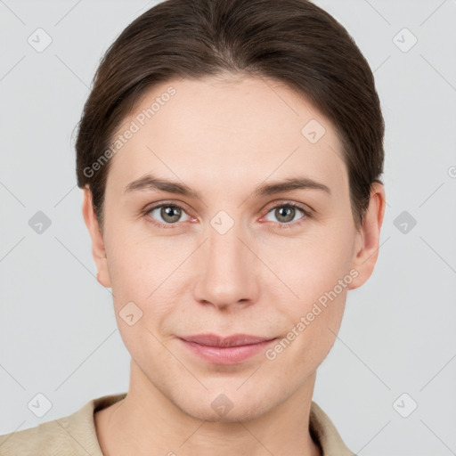 Joyful white young-adult female with short  brown hair and grey eyes