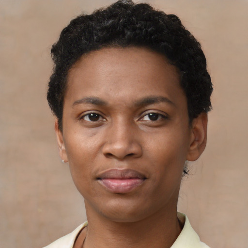 Joyful black young-adult female with short  black hair and brown eyes