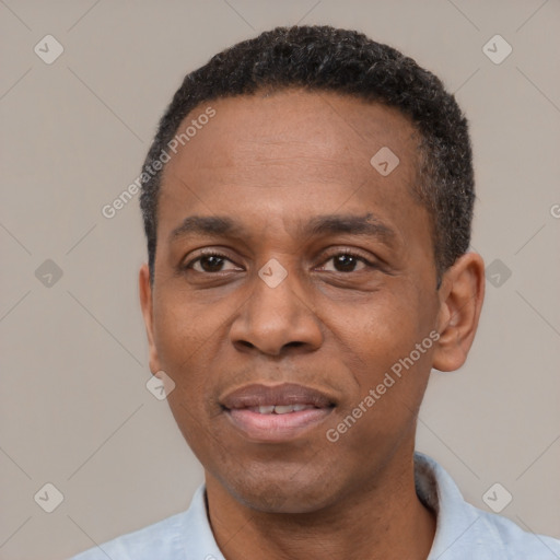 Joyful latino adult male with short  black hair and brown eyes