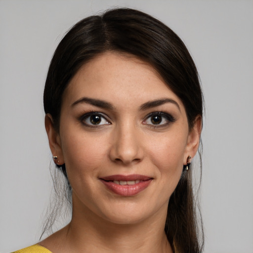 Joyful white young-adult female with medium  brown hair and brown eyes