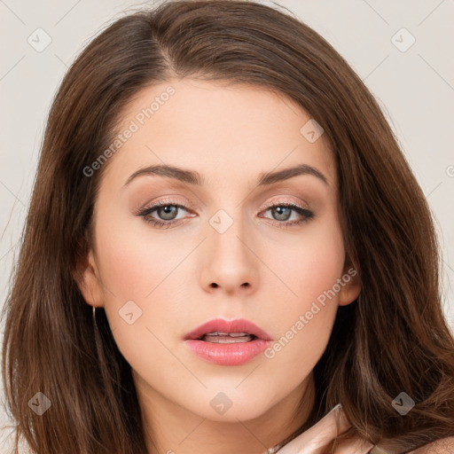 Neutral white young-adult female with long  brown hair and brown eyes