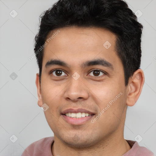 Joyful latino young-adult male with short  black hair and brown eyes