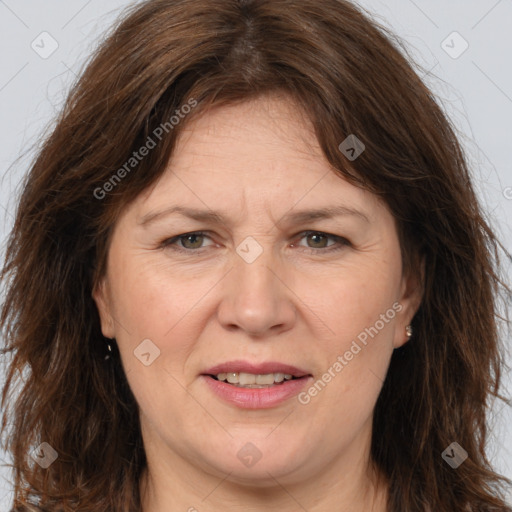 Joyful white adult female with long  brown hair and brown eyes