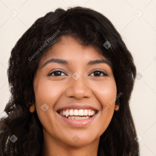 Joyful latino young-adult female with long  black hair and brown eyes