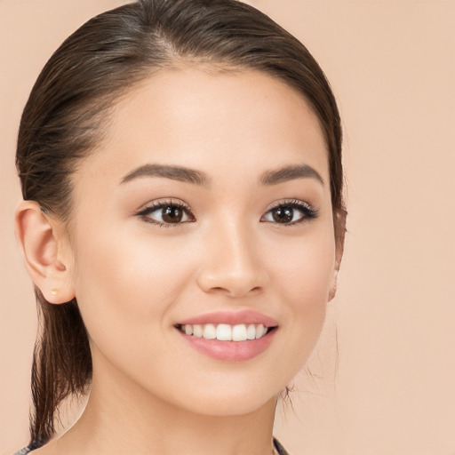 Joyful white young-adult female with long  brown hair and brown eyes