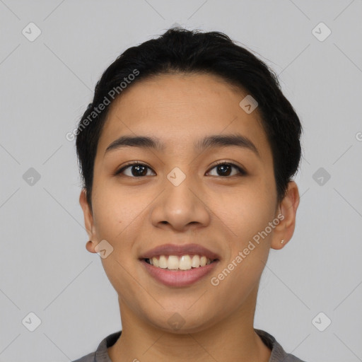 Joyful asian young-adult female with short  black hair and brown eyes