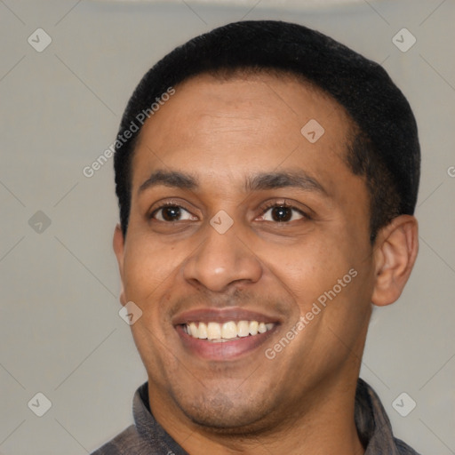 Joyful latino young-adult male with short  black hair and brown eyes