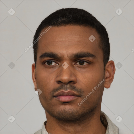 Neutral latino young-adult male with short  black hair and brown eyes