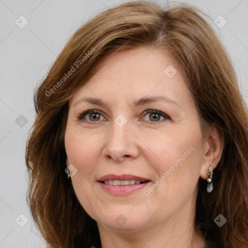 Joyful white adult female with long  brown hair and brown eyes