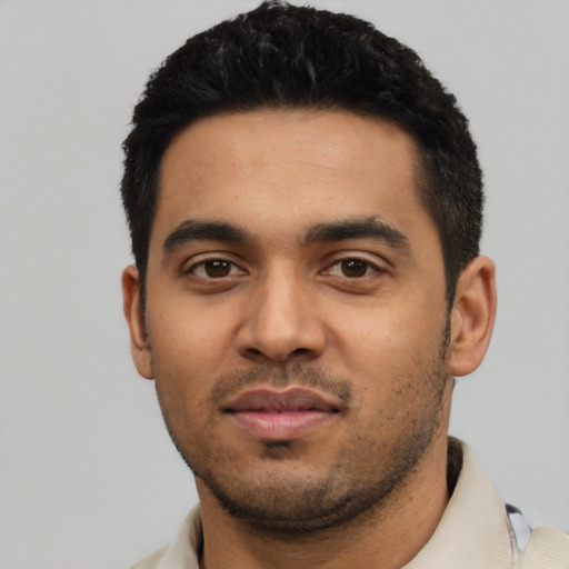 Neutral latino young-adult male with short  black hair and brown eyes