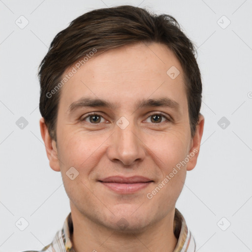 Joyful white adult male with short  brown hair and brown eyes