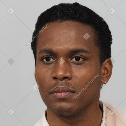 Neutral black young-adult male with short  black hair and brown eyes