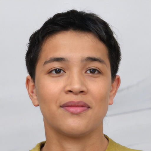 Joyful asian young-adult male with short  brown hair and brown eyes