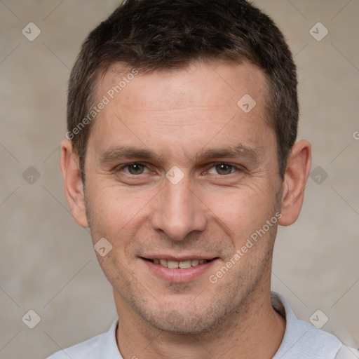 Joyful white adult male with short  brown hair and brown eyes