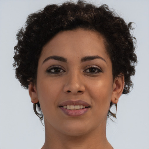 Joyful latino young-adult female with short  brown hair and brown eyes